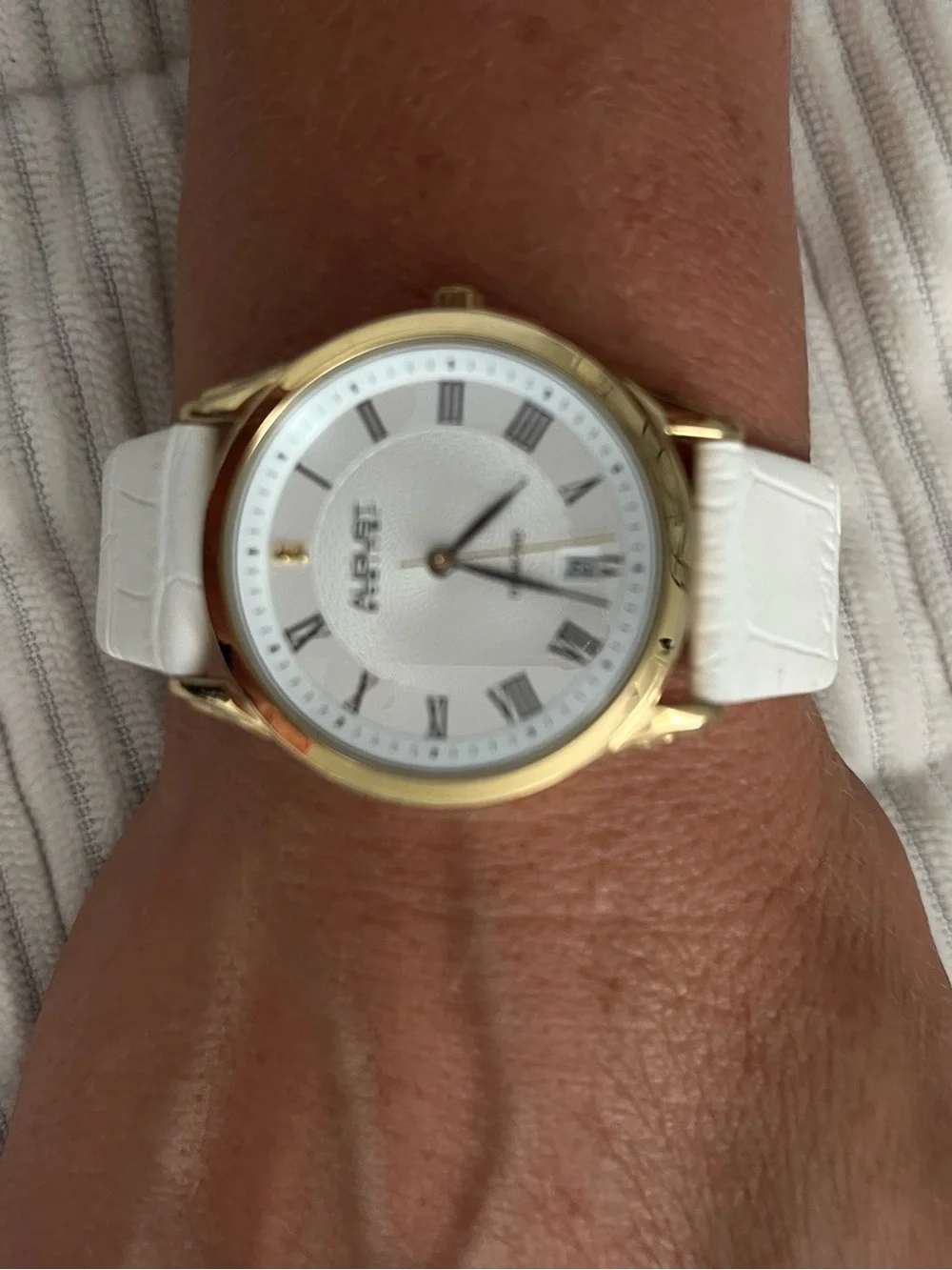August Steiner diamond watch. New. White leather band.